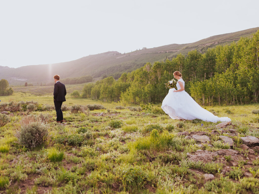 Bride walks towards groom for first look near Park City Utah