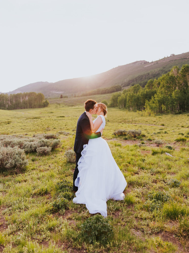Bride and groom share kiss before Utah wedding