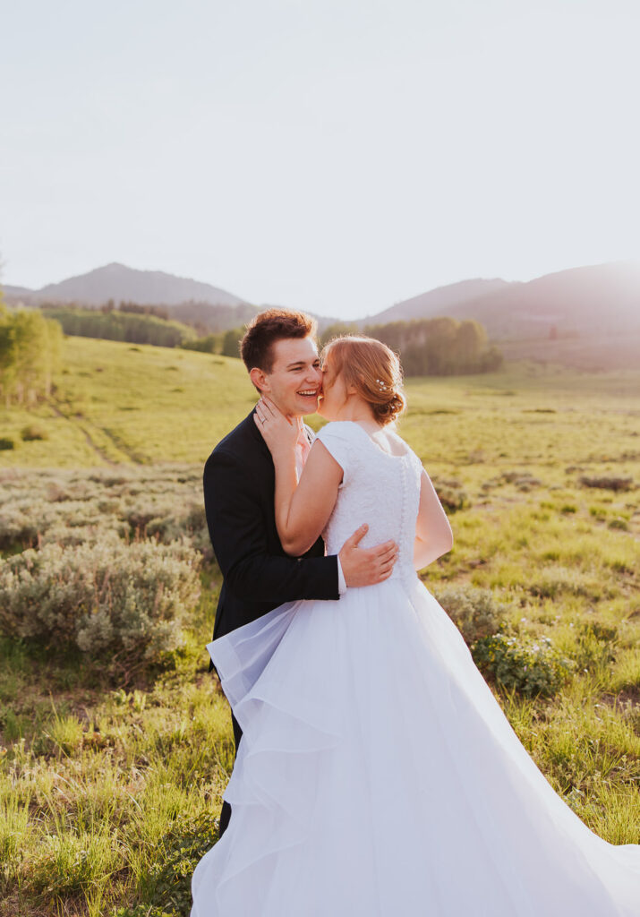 Bride and groom smile in Utah wedding
