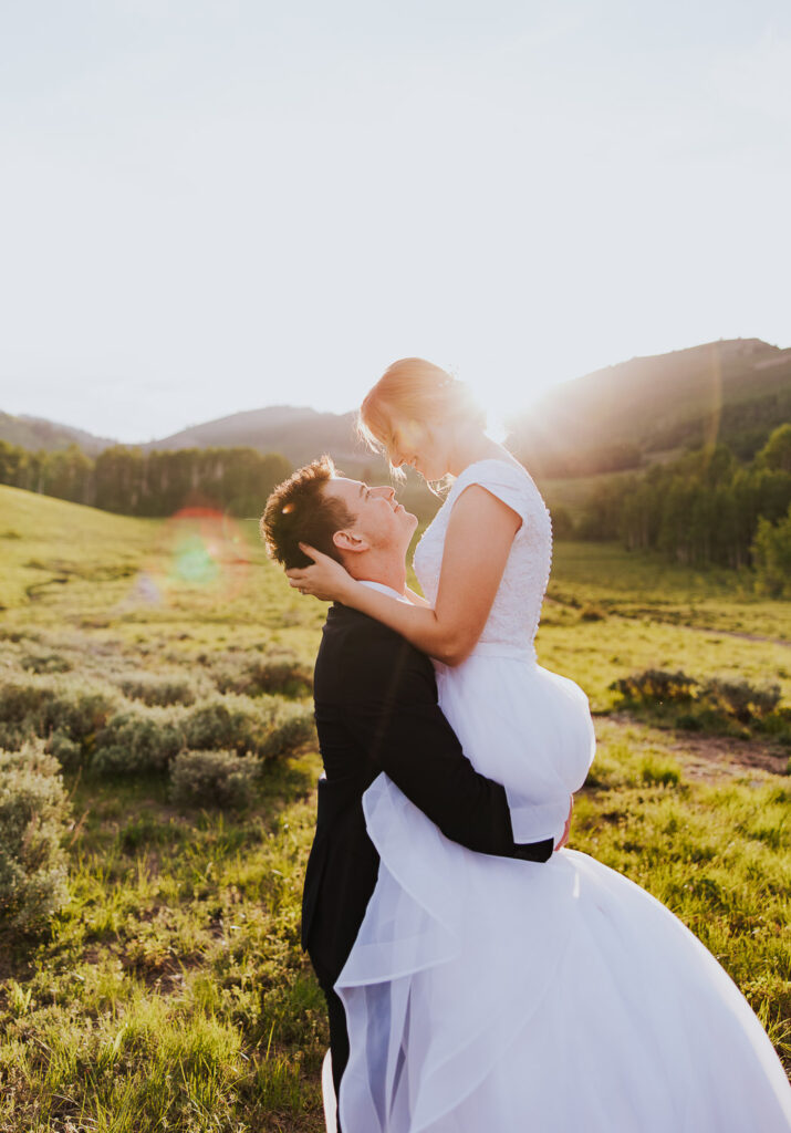 Beautiful wedding pose with sun flare