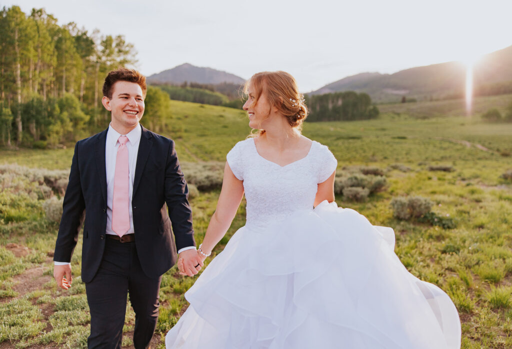 Utah wedding in green field at sunset