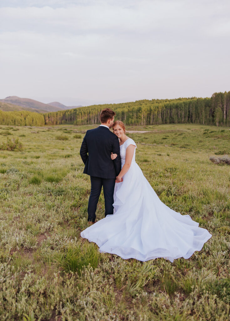 Bride rests head on groom's shoulder
