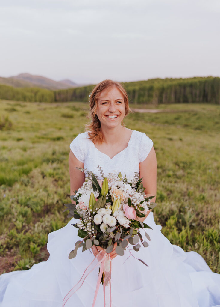 Bride laughs in white wedding dress