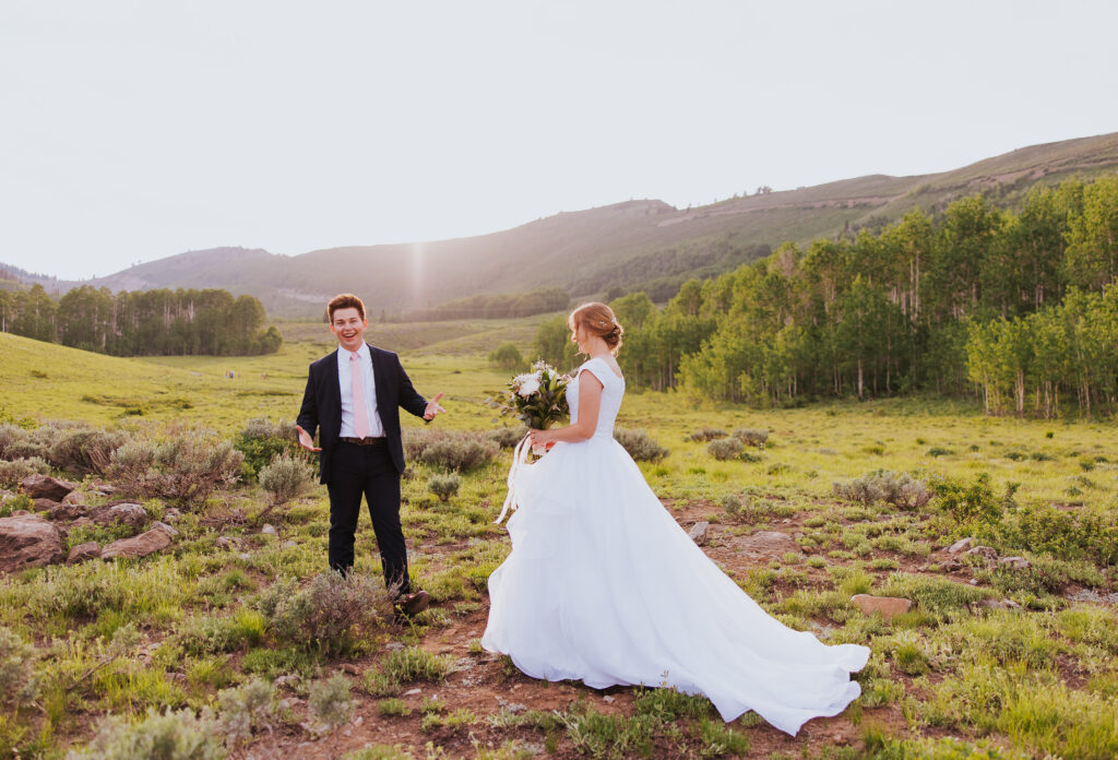 Bride shows wedding dress to groom before Utah wedding