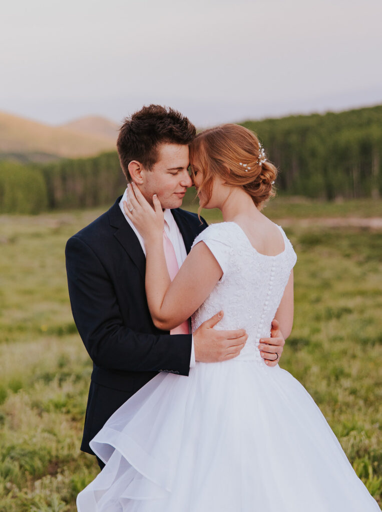 Bridal hair updo with flowers and braid