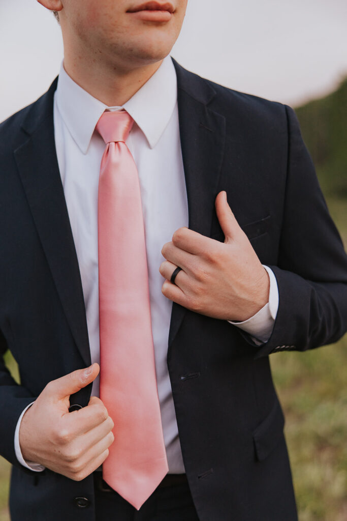 Detail of groom's tie, watch, and wedding ring