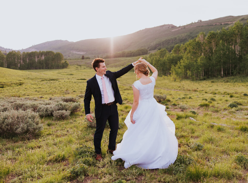 Groom twirls bride before Park City Utah wedding