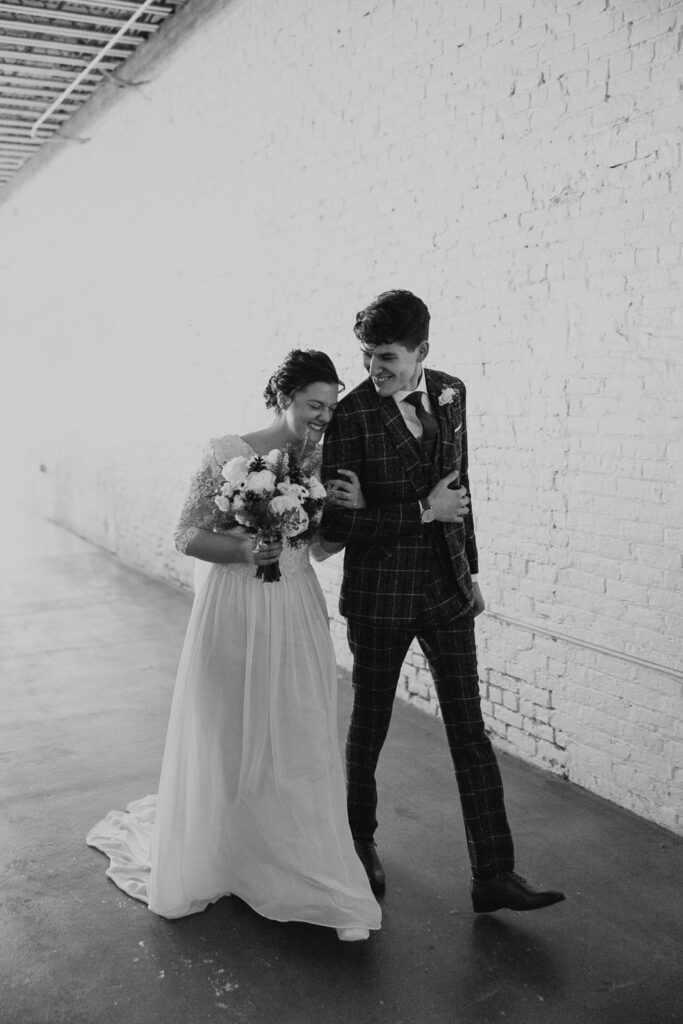 Bride and groom walk together after their marriage ceremony in Ohio