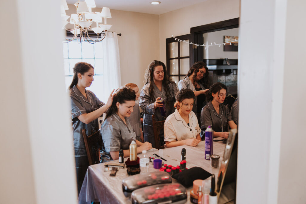 Bridesmaids help bride get ready for wedding day in Ohio