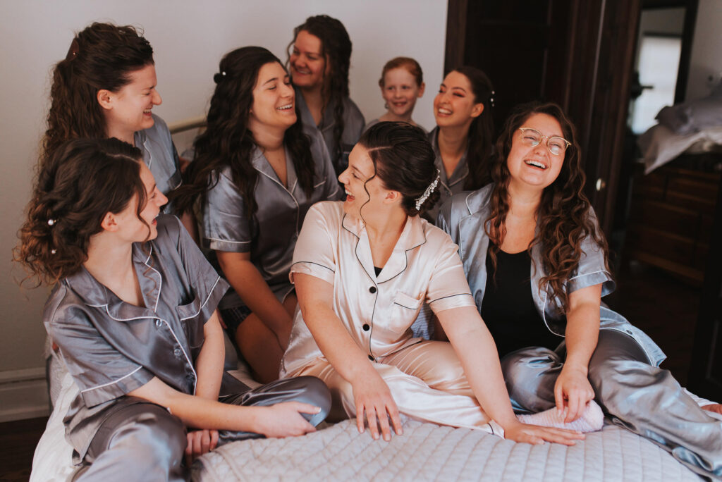 Bride and bridesmaids wear matching pajamas