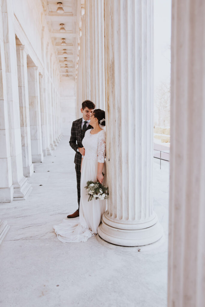 Bride and groom pose at the Toledo Museum of Art